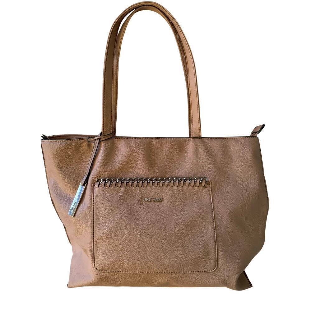 Nine West pastel pink tote with bold chained design front pocket.